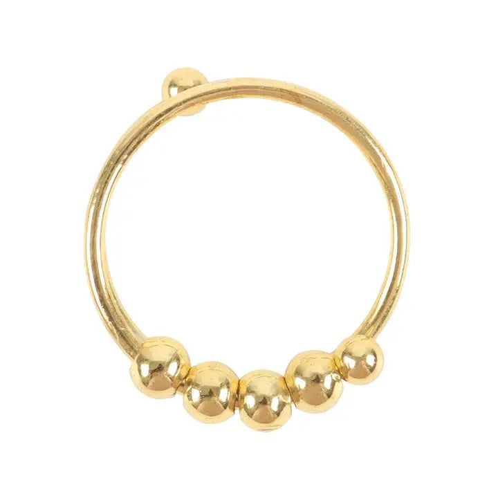 Close-up of Luna &amp; Soul gold spinning fidget ring showing polished adjustable bead design.