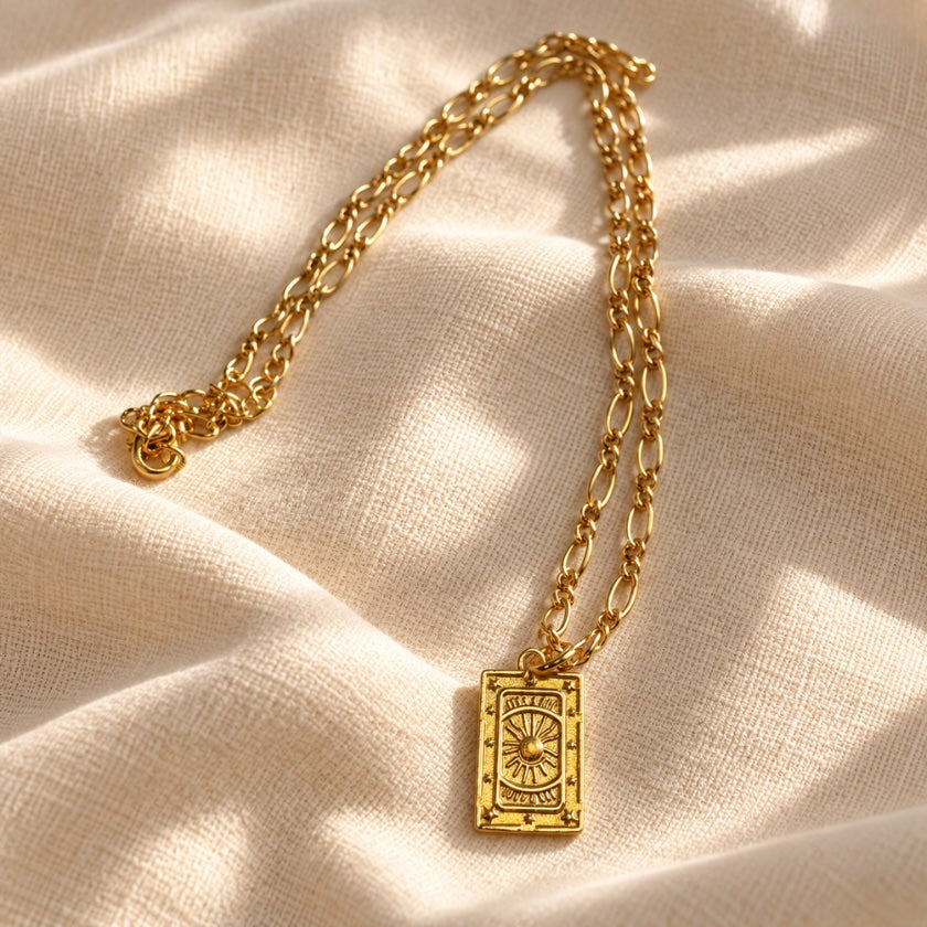 18kt gold-plated brass necklace with rectangular pendant and detailed chain.