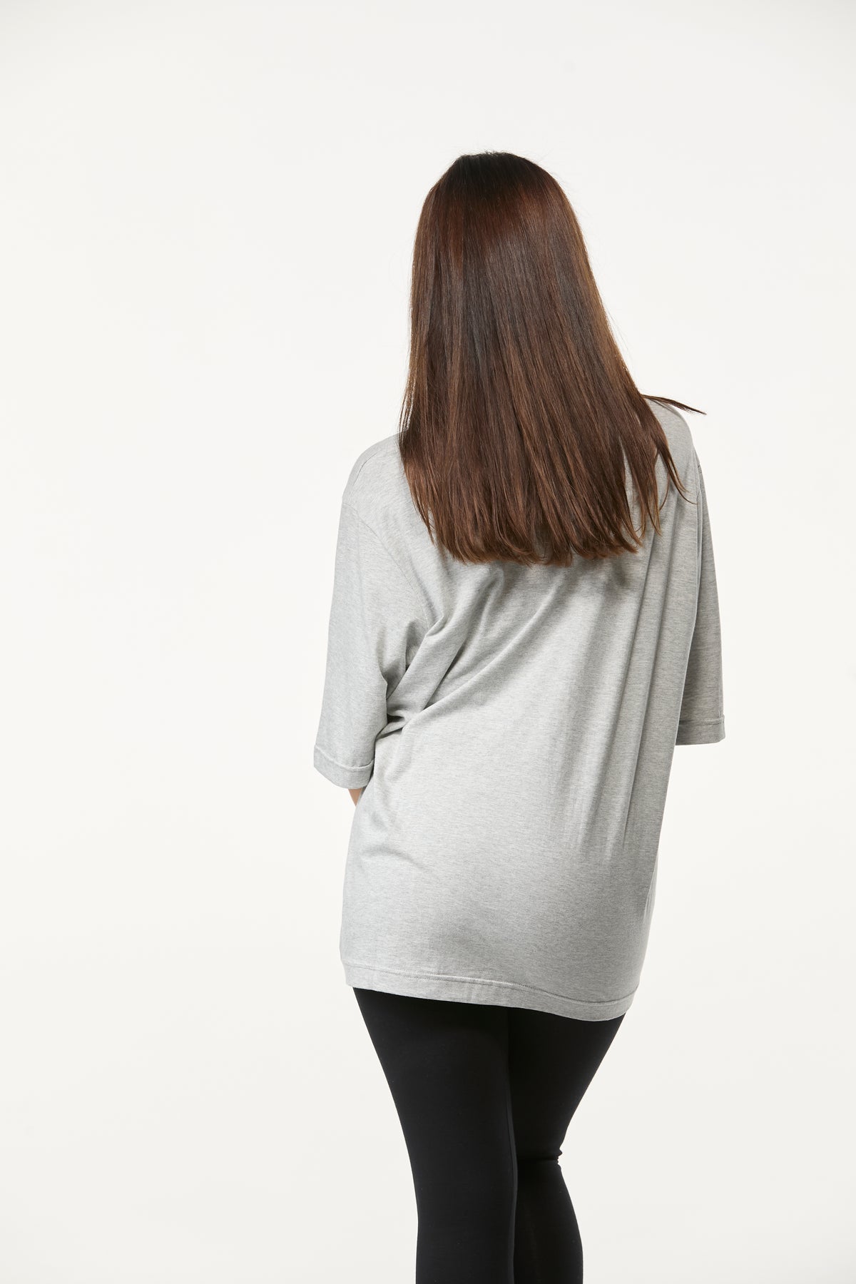 Back view of grey oversized tee for women with an easy relaxed silhouette and minimal style