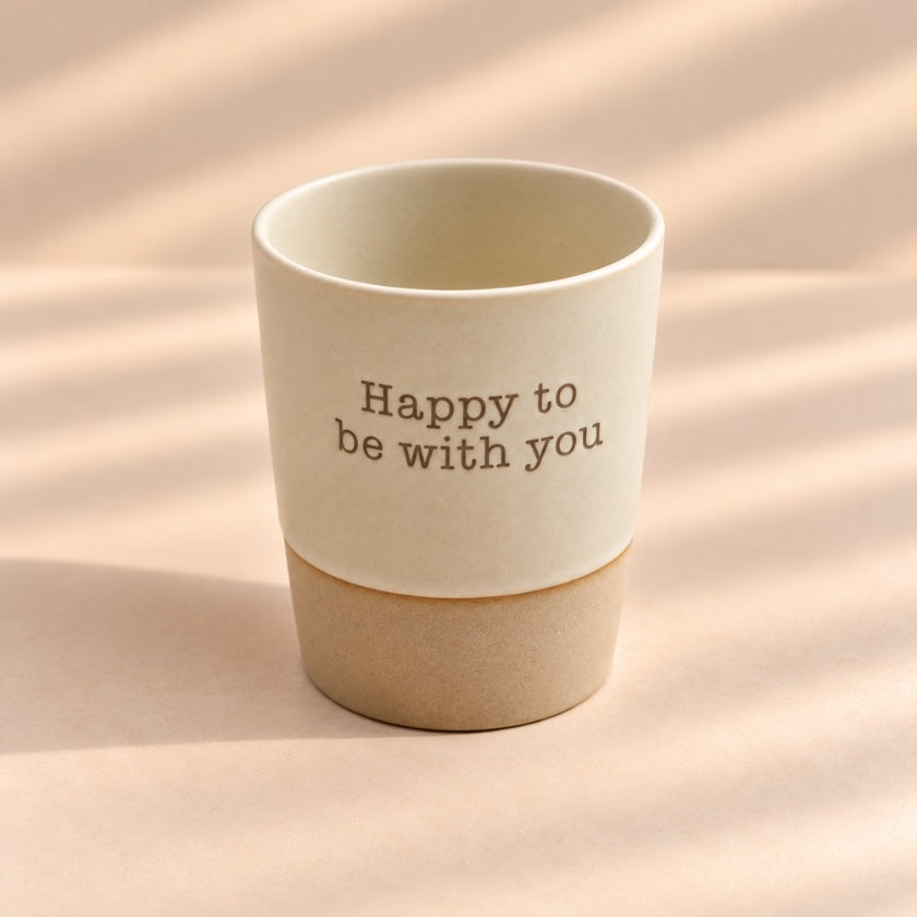 Happy to Be With You hand-glazed ceramic mug in soft natural cream with earthy ceramic base.