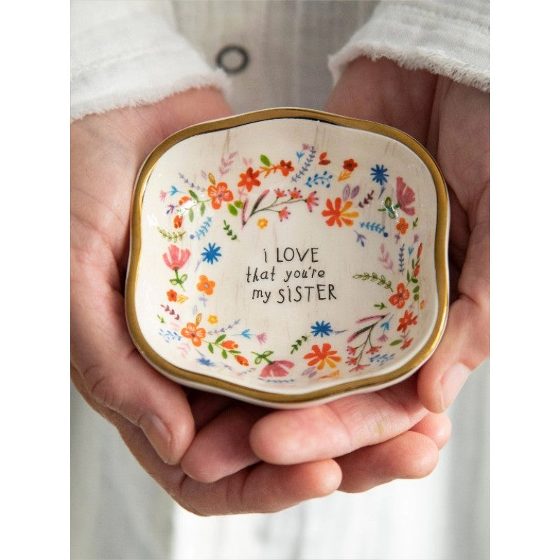 Luna &amp; Soul ceramic trinket dish with colourful floral artwork, gold edging and the message "I love that you're my sister."