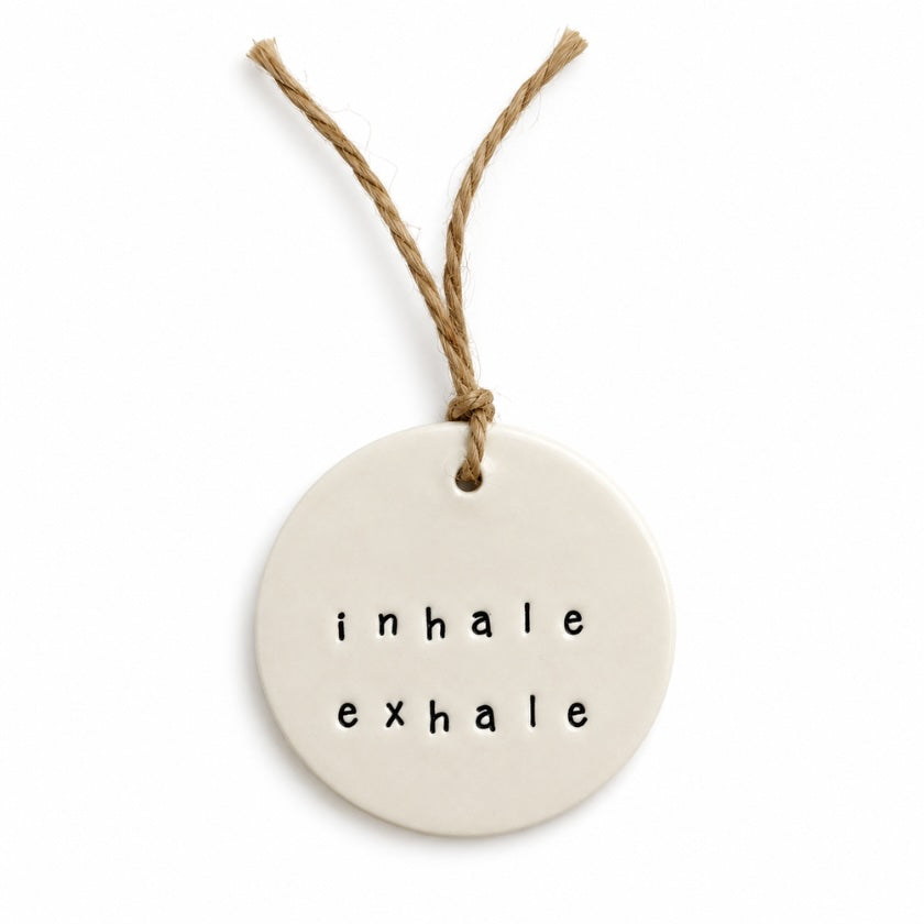 Luna and Soul Inhale Exhale handmade ceramic tag with jute twine on white background
