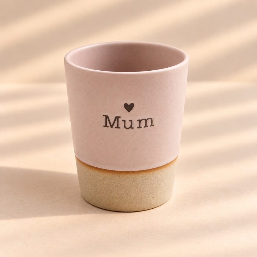 Mum hand-glazed ceramic mug in soft blush pink with heart detail and natural-toned base