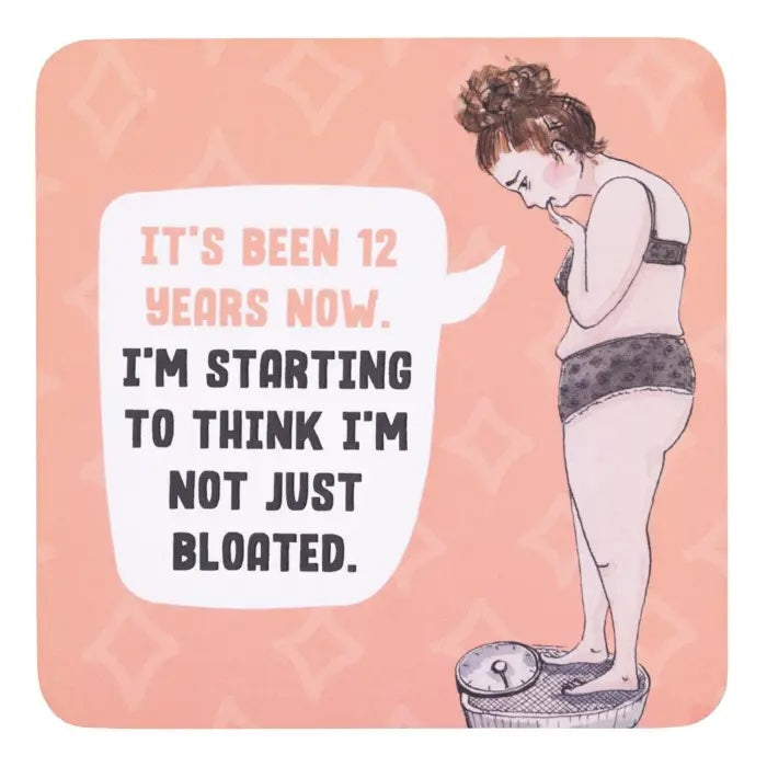 Not Just Bloated coffee coaster with peach background and hand-drawn woman standing on bathroom scales.