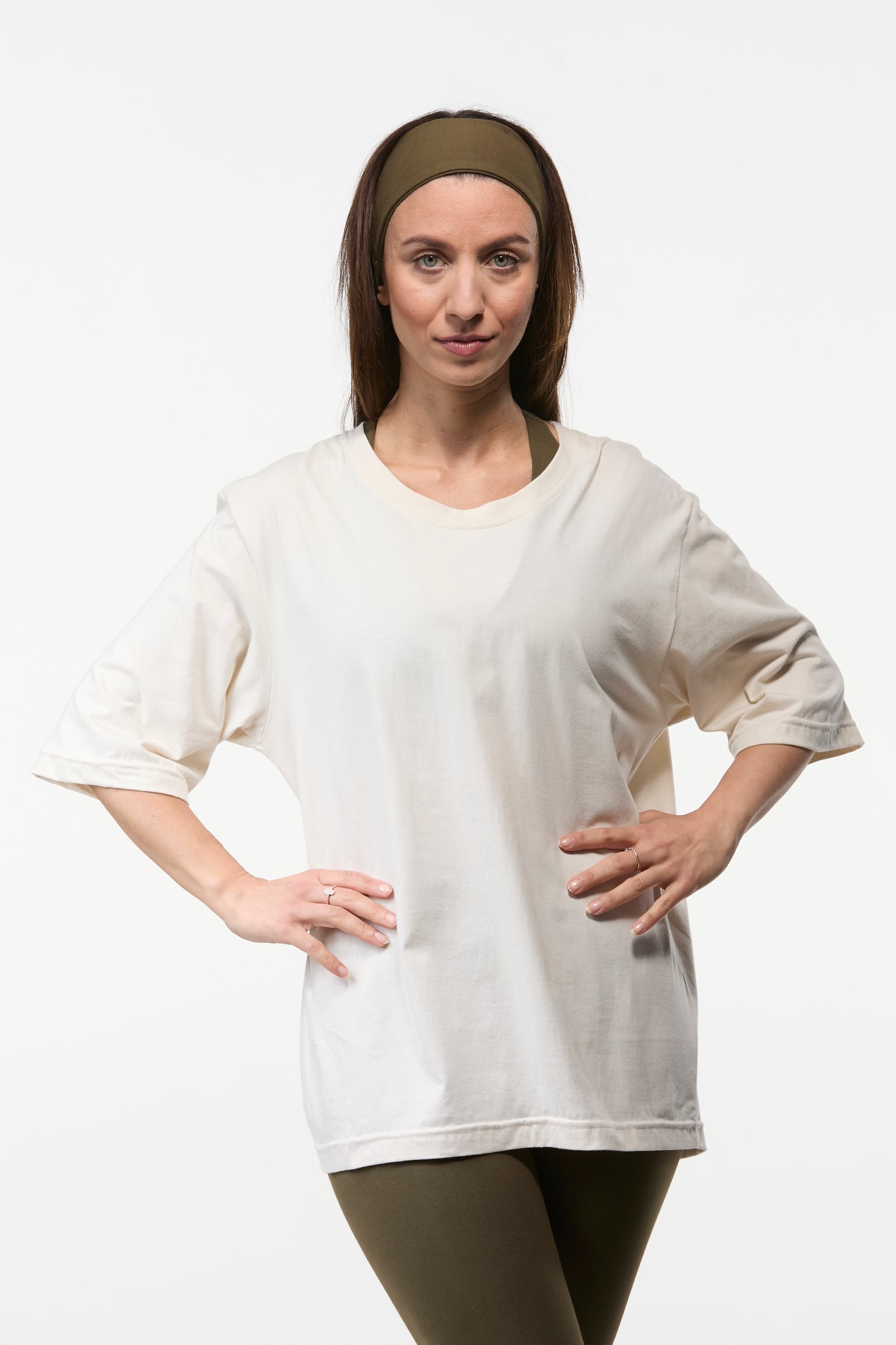 Woman wearing a oat oversized tee with khaki  leggings, relaxed fit top for yoga and everyday wear