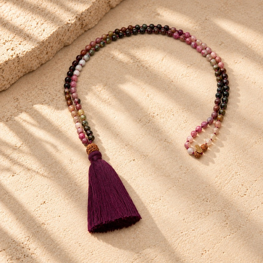 Pink Tourmaline and Rudraksha 108 bead mala necklace with AUM charm.