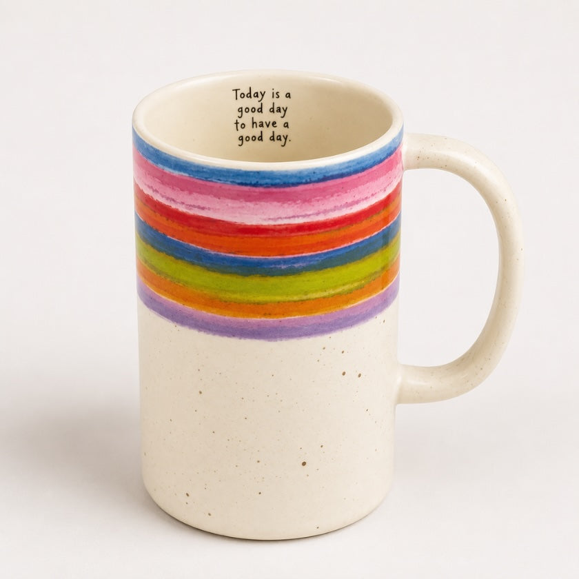 Speckled ceramic mug with colourful rainbow stripe design and “Today is a good day to have a good day” quote inside the mug.