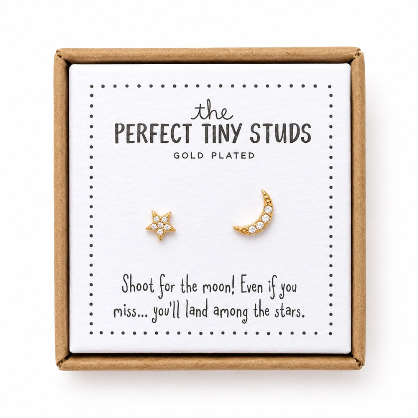 Gold plated moon and star stud earrings with crystal details presented on an inspirational gift card featuring “Shoot for the moon” quote in a kraft gift box.