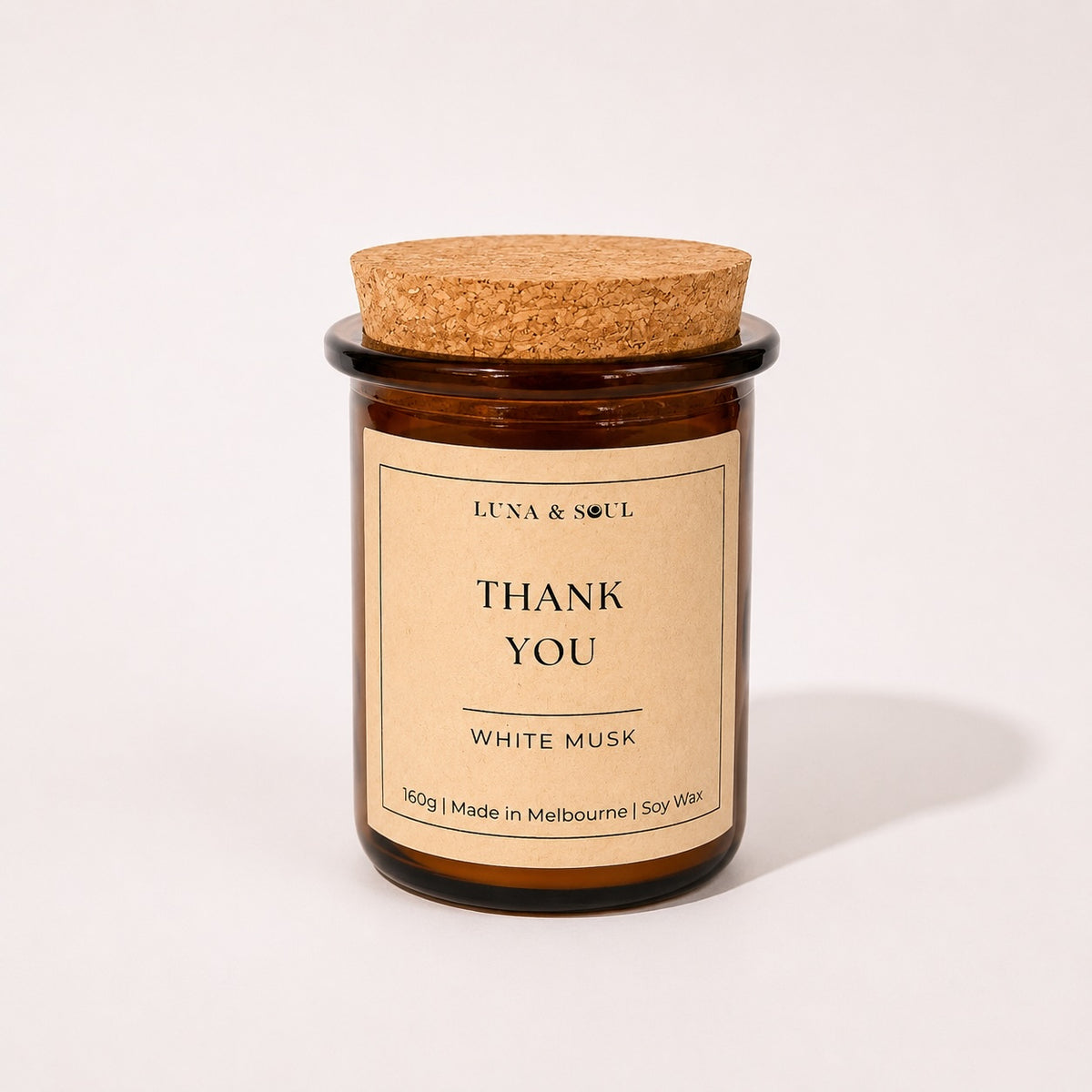 Luna &amp; Soul Thank You soy candle in amber glass with natural cork lid.
