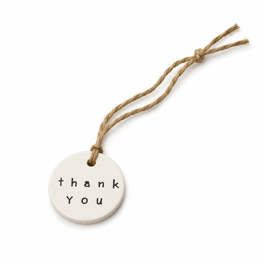 Luna and Soul Thank You handmade ceramic tag with jute twine on white background.
