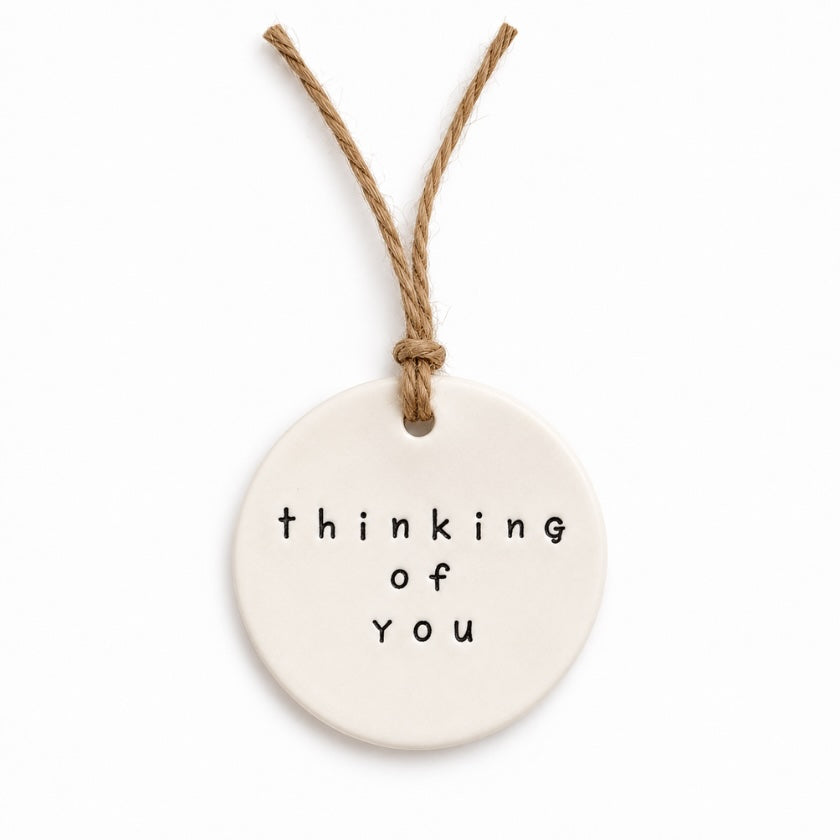 Cream round Thinking of You ceramic tag with natural twine by Luna &amp; Soul.