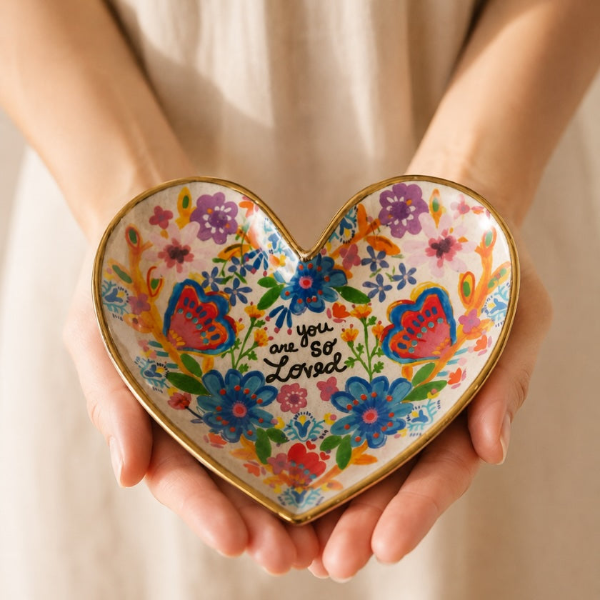 You Are So Loved heart trinket dish with colourful floral and butterfly artwork and gold edging.