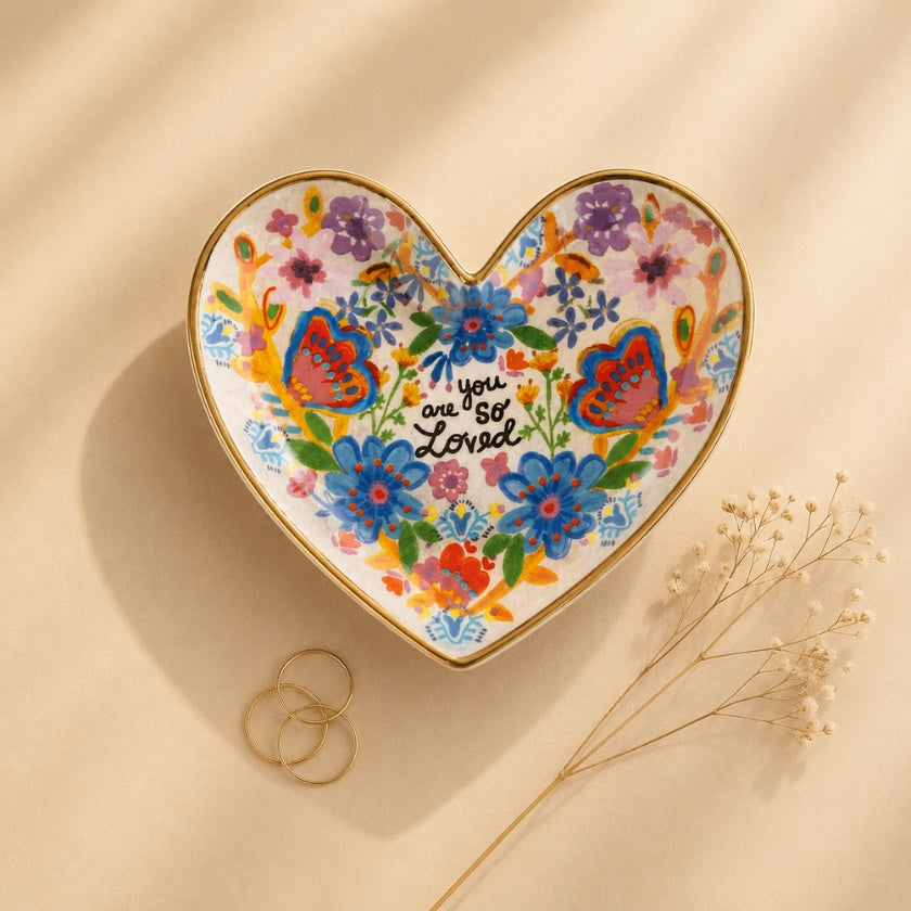 You Are So Loved heart trinket dish with colourful floral and butterfly artwork and gold edging.