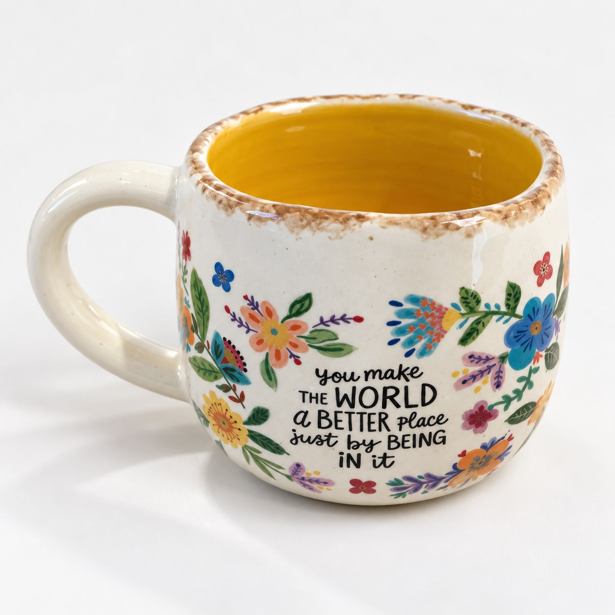 Colourful floral ceramic mug with You Make The World A Better Place message.
