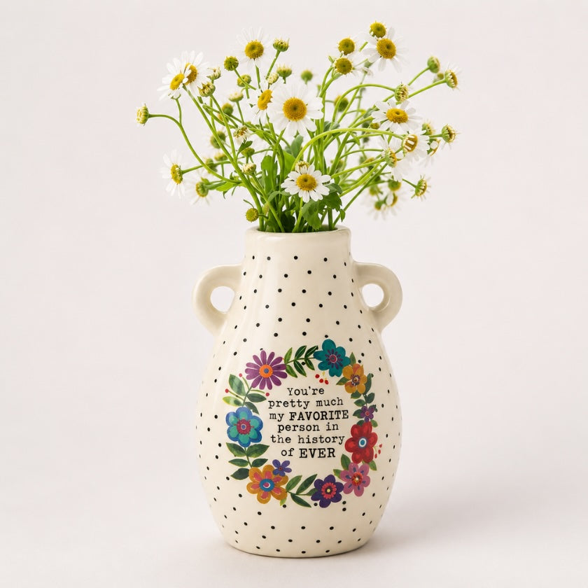 Cream ceramic floral vase with black polka dot pattern, colourful flower wreath and “You’re pretty much my favourite person in the history of ever” quote, styled with fresh white daisies.