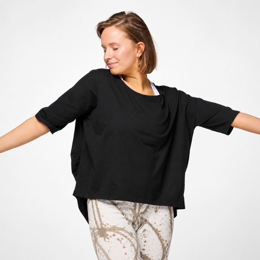 Black organic cotton Zen yoga top — arms out showing relaxed oversized fit, Luna &amp; Soul