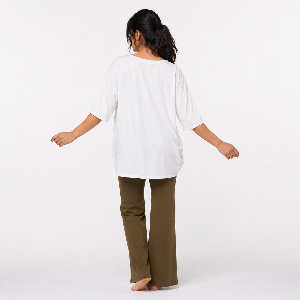 Back view of Zen organic cotton yoga top — longer hi-low hem, off-white activewear