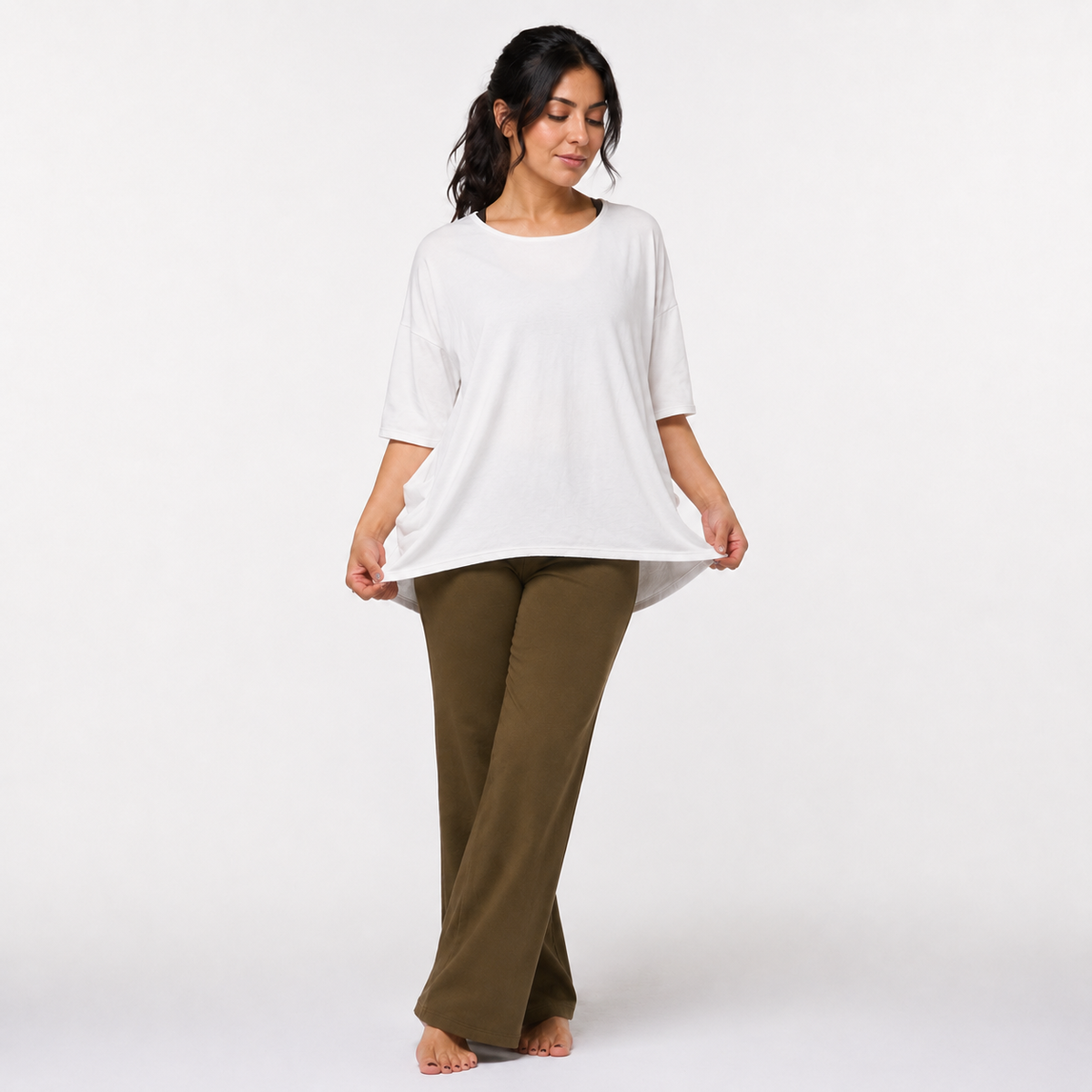 Zen organic cotton yoga top in off-white — front view showing hi-low hem detail