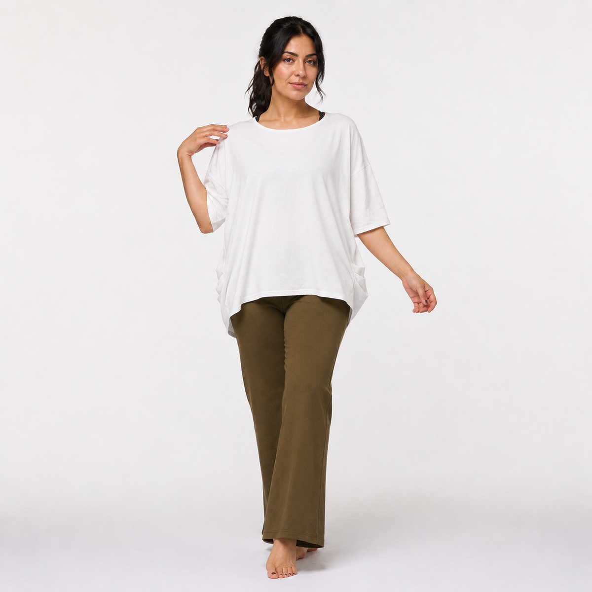 Off-white organic cotton oversized yoga top — model walking, front view