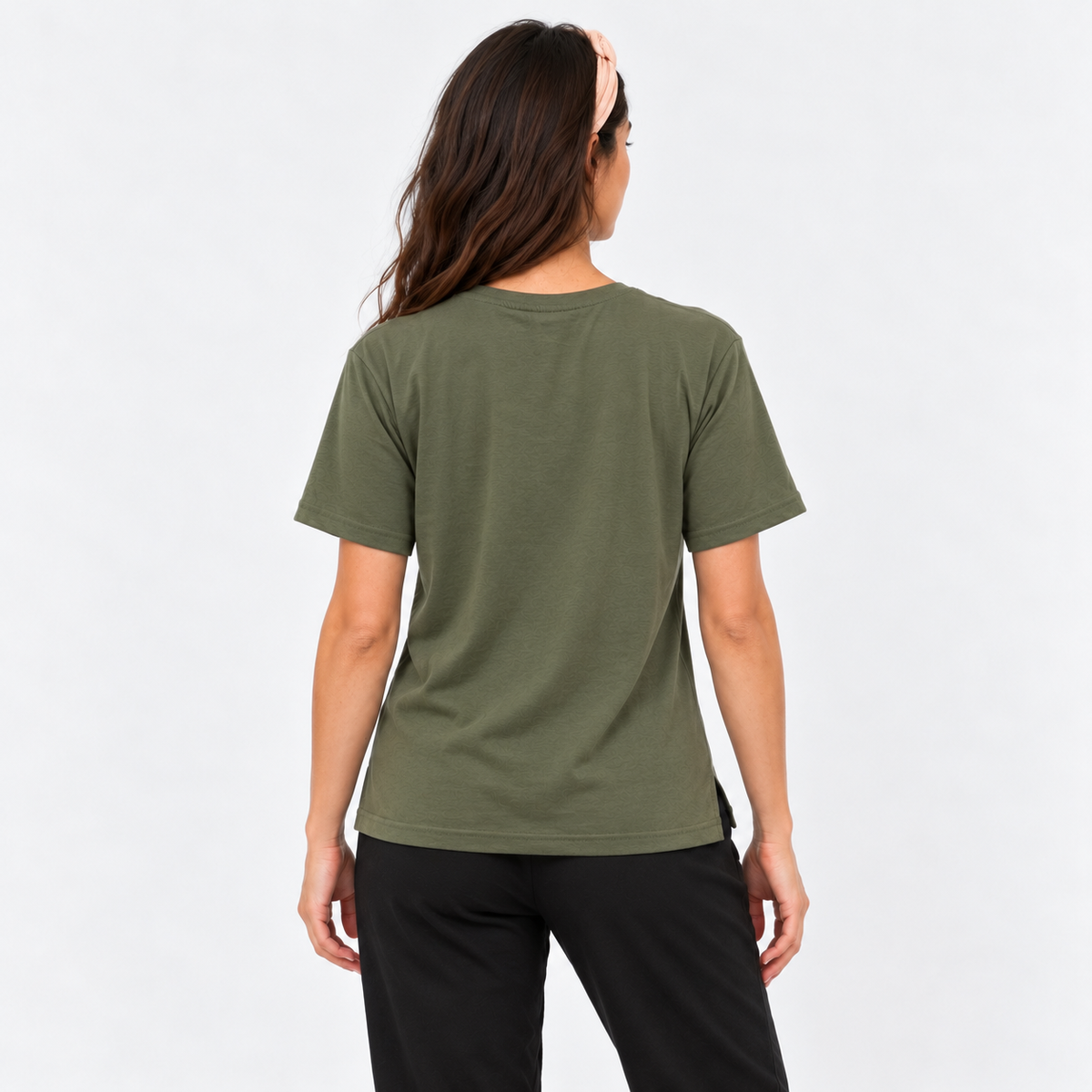 Back view of the Luna T-Shirt in khaki, a relaxed crew neck yoga tee with side splits, styled with black pants by Luna &amp; Soul