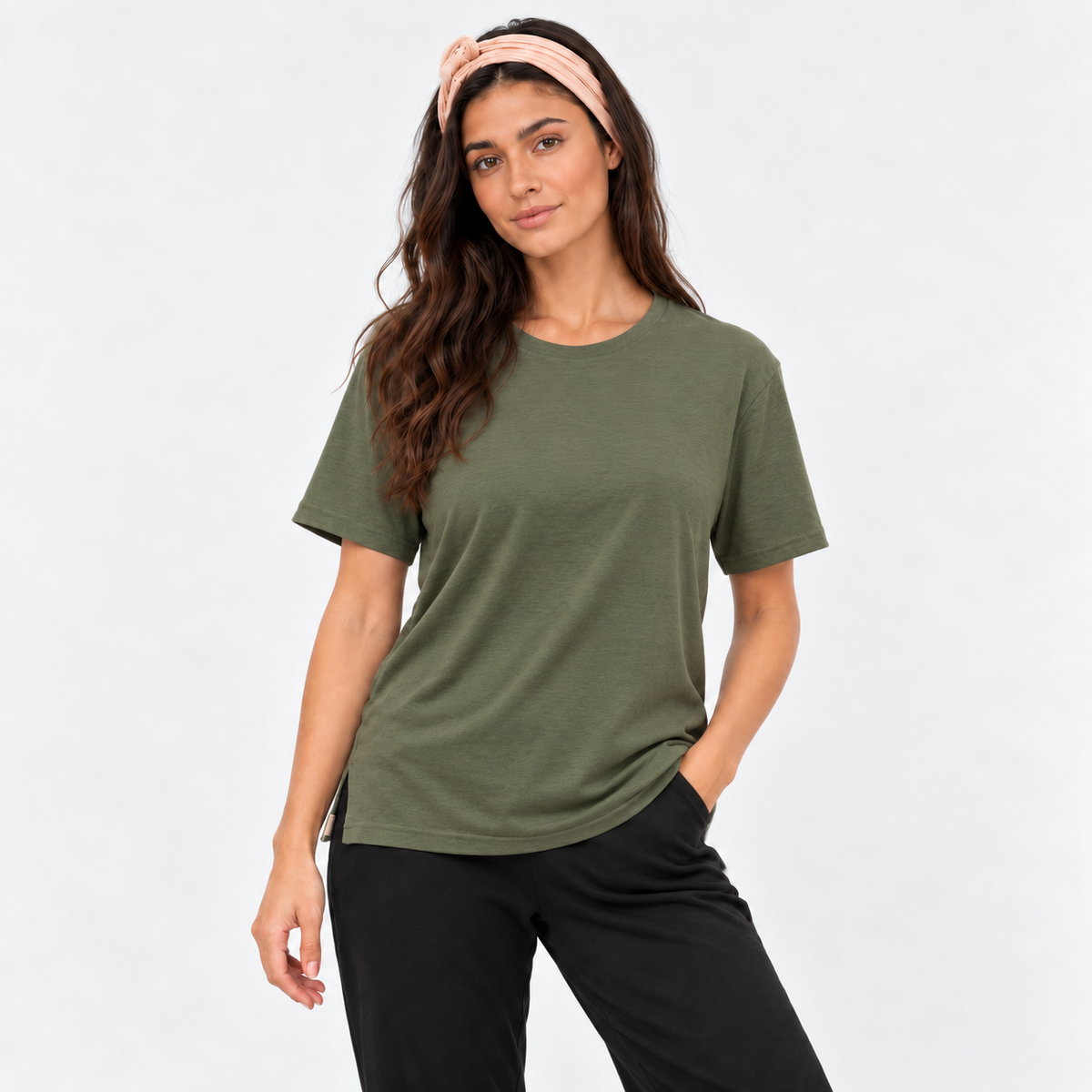 Woman wearing the Luna T-Shirt in khaki , a relaxed crew neck yoga tee with side splits, styled with black pants by Luna &amp; Soul