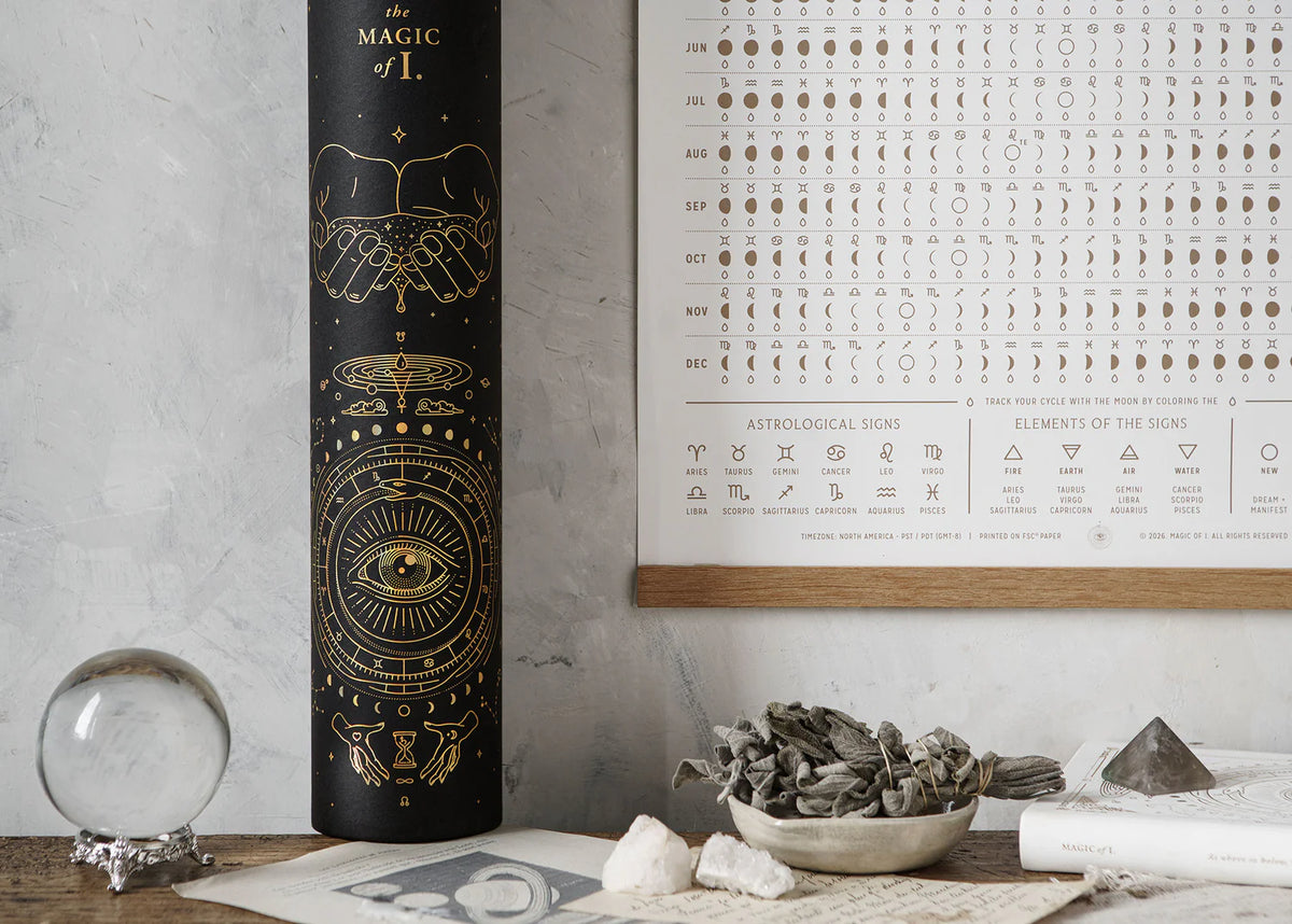 Close-up of Magic of I 2026 Moon Phases and Signs Calendar packaging tube with celestial gold design