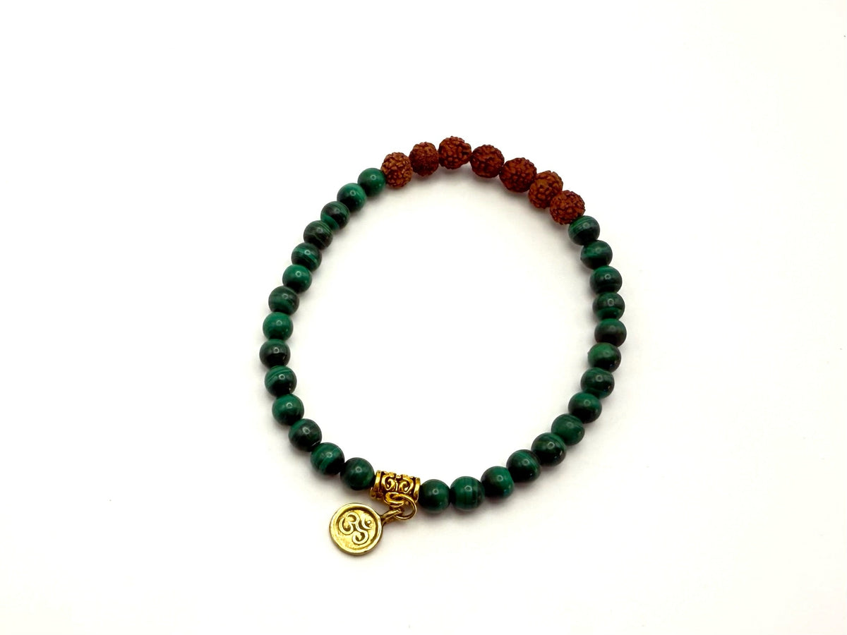 Handmade malachite mala bracelet with gold plated discs and an AUM charm, 6 mm green gemstone beads on elastic.
