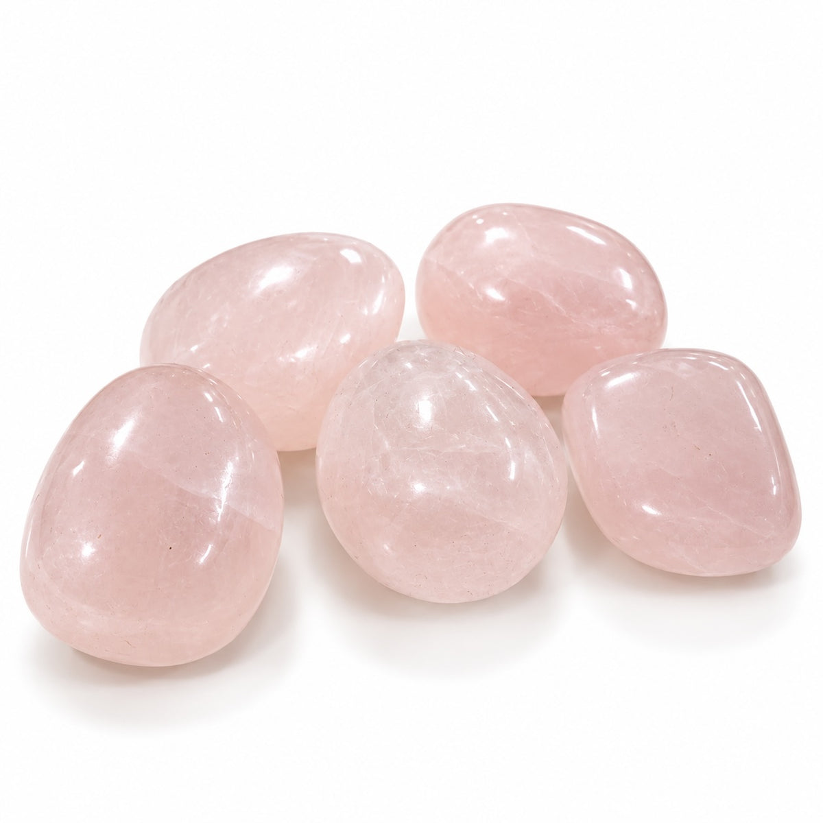 Pink Calcite tumble stone showing its natural pink colouring and polished surface.