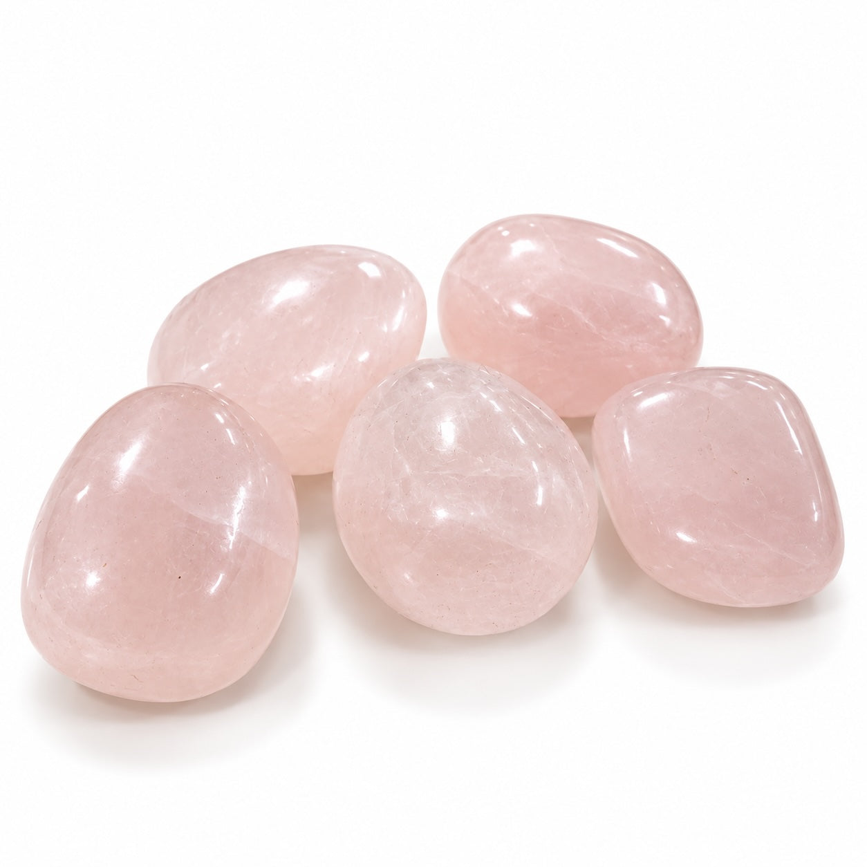 Pink Calcite tumble stone showing its natural pink colouring and polished surface.