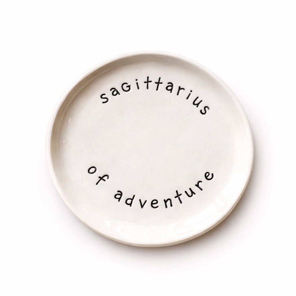 Handmade Sagittarius zodiac ceramic plate with full of passion text in glazed earthenware