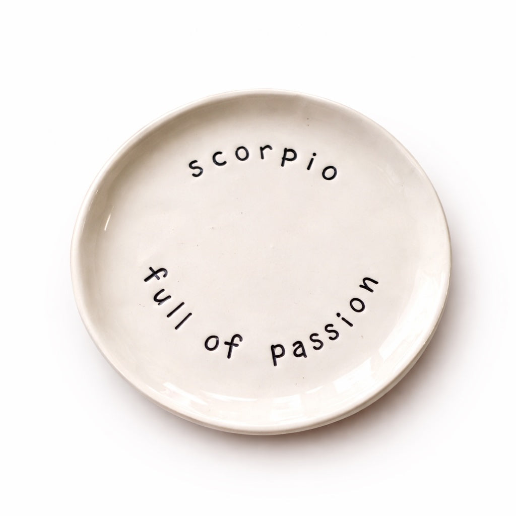 Handmade Scorpio zodiac ceramic plate with full of passion text in glazed earthenware
