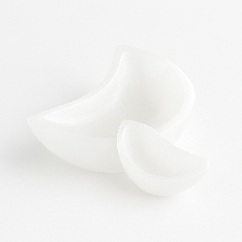 Small and large selenite bowls side by side
