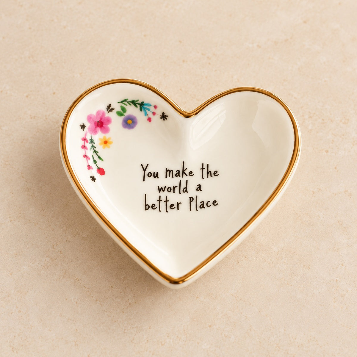 Small ceramic heart trinket dish with a gold rim, floral details and an uplifting message. A thoughtful gift for someone special.