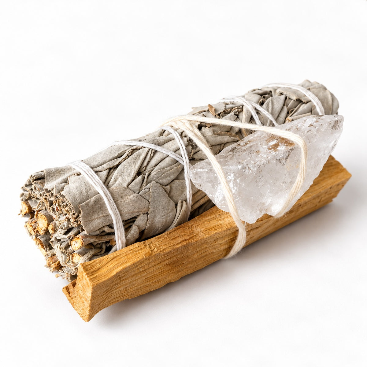 Small White Sage smudge stick kit with approximately 10 cm sage, Palo Santo wood and a Clear Quartz crystal.