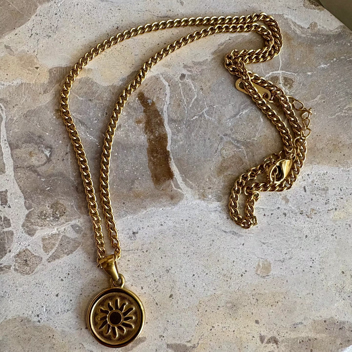 Solar Radiance Necklace with golden sun medallion design