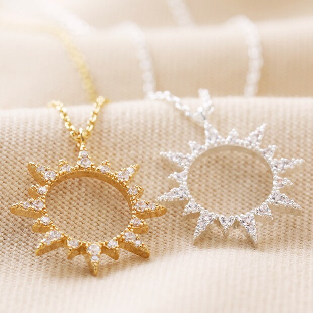 Silver sunburst pendant necklace with rainbow cubic zirconia crystals