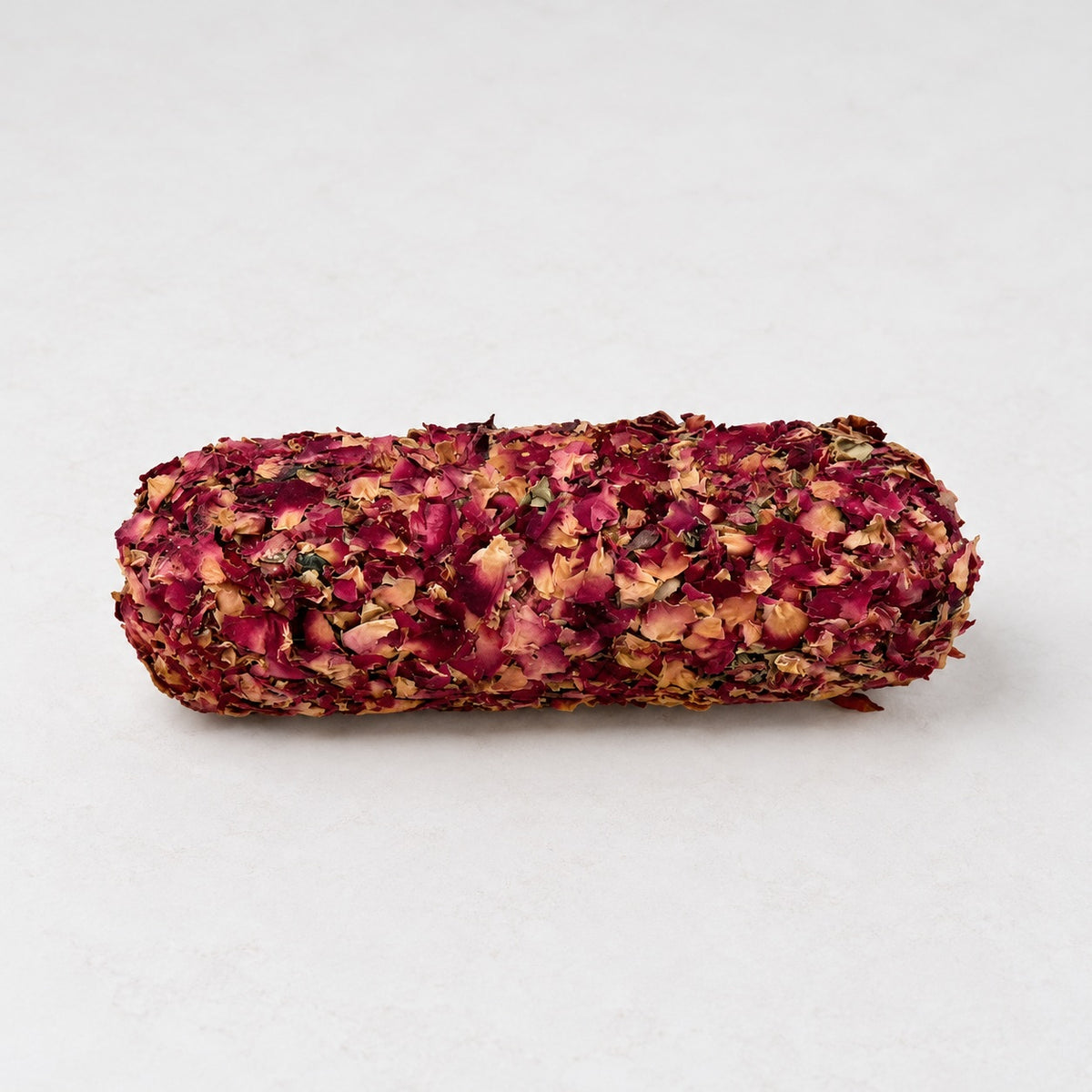 Unconditional Love White Sage smudge stick decorated with dried rose petals, handmade in Australia and measuring approximately 15 to 16 cm long.