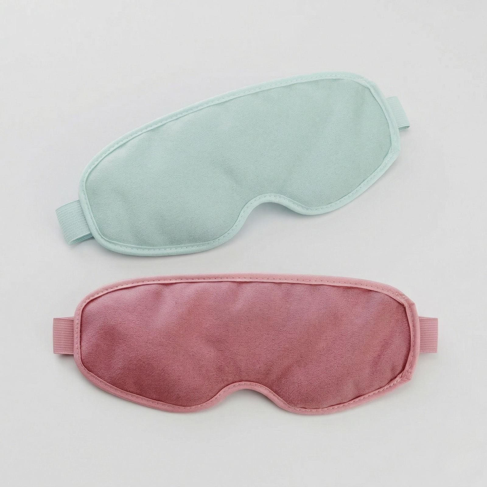 Soft weighted eye mask for relaxation, sleep, meditation, and travel in pink and sage green
